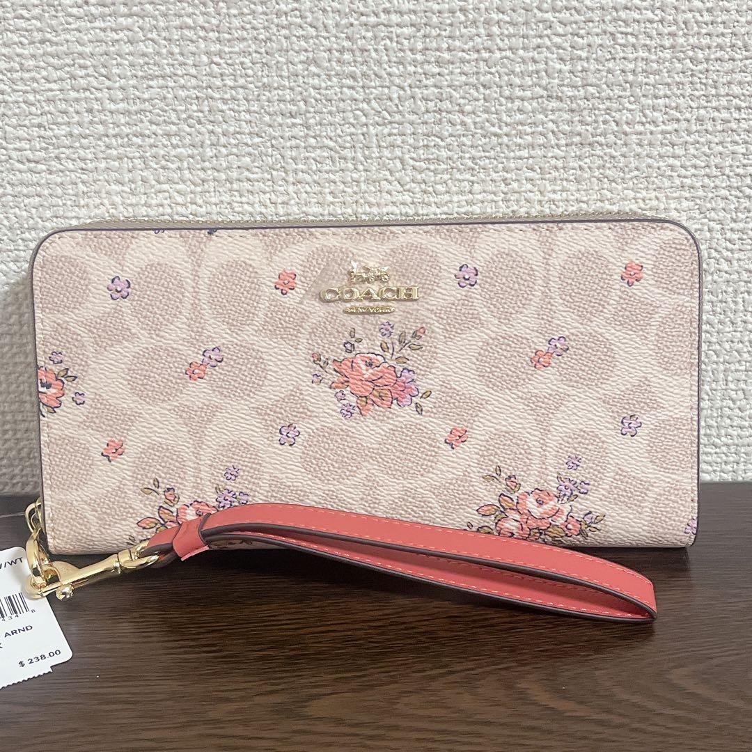 コーチ　 長財布　ベージュ　ストラップ付　花柄　シグネチャー　ラウンドファスナー